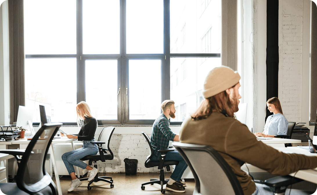 A group of people working in an open office space